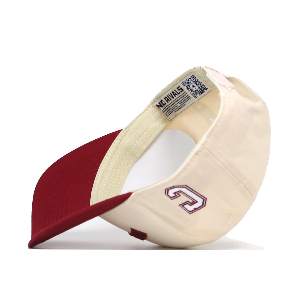 The College of Charleston | Upside Down Charleston Hat - Classic by No Rivals is shown upside down, displaying the inside label reading NO RIVALS. A stylized G is embroidered on the cream side of the cap. This officially licensed snapback blends classic style with premium details for any true fan.