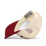 The College of Charleston | Upside Down Charleston Hat - Classic by No Rivals is shown upside down, displaying the inside label reading NO RIVALS. A stylized G is embroidered on the cream side of the cap. This officially licensed snapback blends classic style with premium details for any true fan.