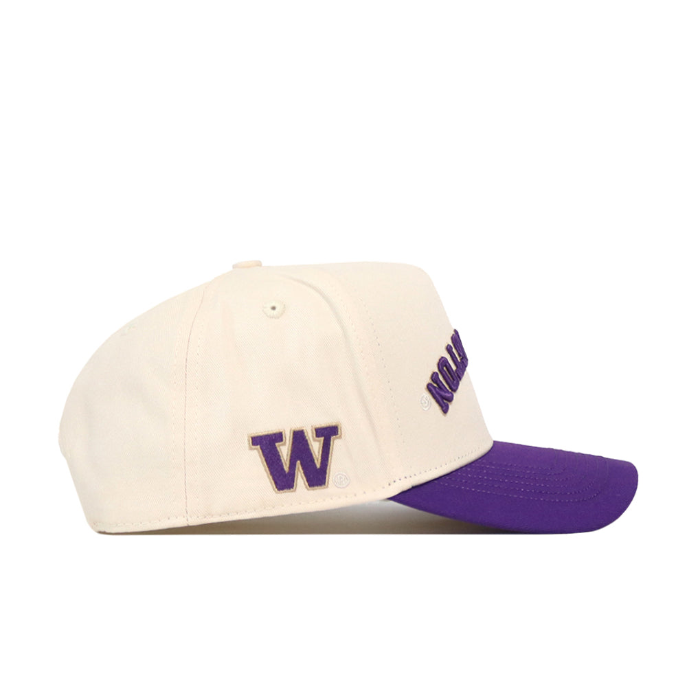 Introducing the Washington Huskies Upside Down Washington Hat - Classic from No Rivals: this cream-colored, adjustable snapback baseball cap features a striking purple brim. A bold purple “W” is embroidered on the side, while “Huskies” appears in purple lettering on the front—making it the ideal hat for any dedicated Washington Huskies fan.