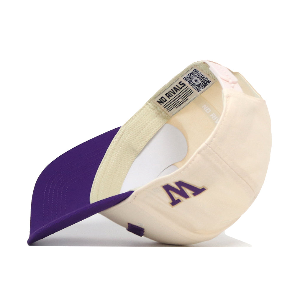 Here’s the revised sentence using your product data: The Washington Huskies Upside Down Washington Hat - Classic by No Rivals features a cream and purple design, with a bold purple M logo on the front and “NO RIVALS” printed on the inner band. It has a purple brim, visible inside tag, and an adjustable snapback closure for a comfortable fit.