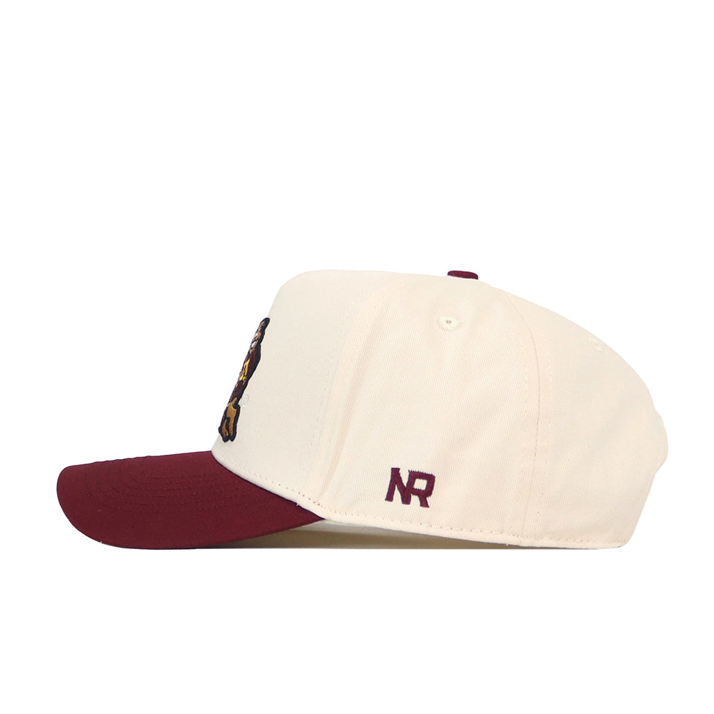 A side view of the Minnesota Gophers Patch Hat by No Rivals reveals its cream color with a maroon brim. The officially licensed snapback features the embroidered “NR” initials in maroon on the side panel near the brim, lending a classic touch to this stylish cap.