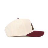 A side view of the No Rivals Minnesota Gophers Patch Hat shows its cream-colored crown and maroon brim. This officially licensed snapback features a partially visible lettered patch on the front panel, adding both authenticity and style.