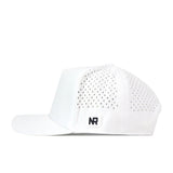 The Creighton Bluejays Baseball Hat in white by No Rivals features small perforated holes on the sides and a black embroidered NR logo patch on the lower left side. Made from performance fabric, this snap back cap is showcased in a side profile view against a white background.