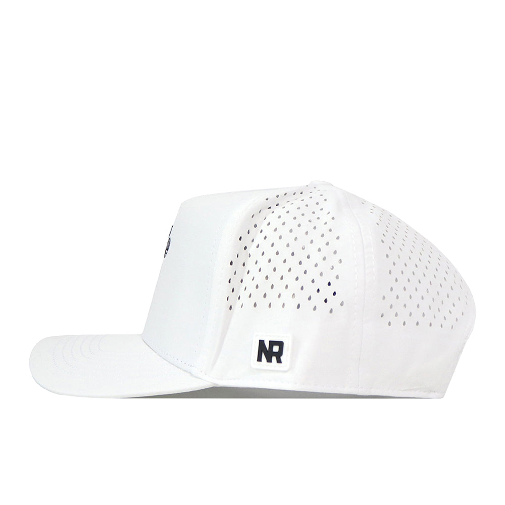 The Creighton Bluejays Volleyball Hat - White by No Rivals is crafted from performance fabric, featuring small ventilation holes on the sides and a black NR embroidered logo patch above the adjustable snap back strap at the back.