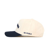 Show your school spirit with the Xavier Musketeers | Upside Down Musketeers Hat - Classic by No Rivals. This officially licensed snapback features a cream color, a navy blue brim, and “NO RIVALS” embroidered on the side in navy text—combining comfort and standout style for any fan.