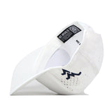 A WVU Mountaineers Football Mascot Hat in white performance fabric is shown turned sideways, featuring an embroidered dark blue zigzag logo on the side, ventilation holes, a flat brim, and an interior No Rivals label.