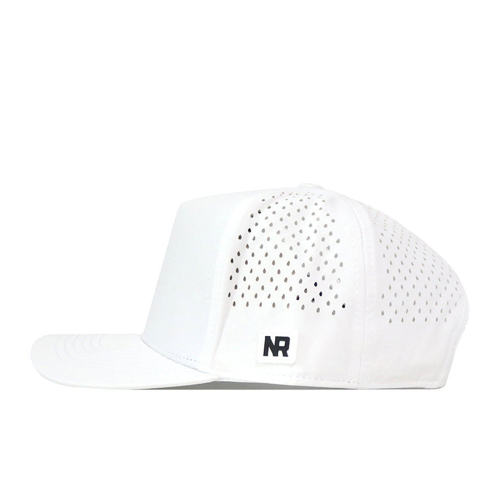 The Creighton Bluejays Golf Hat - White by No Rivals is a white cap featuring small ventilation holes on the side and back panels, a flat brim, a discreet embroidered NR logo on the lower side, and a snapback adjustment for an ideal fit on gameday.