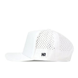 The Creighton Bluejays Golf Hat - White by No Rivals is a white cap featuring small ventilation holes on the side and back panels, a flat brim, a discreet embroidered NR logo on the lower side, and a snapback adjustment for an ideal fit on gameday.