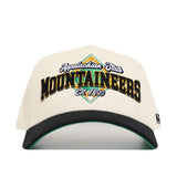 The No Rivals App State Ballpark Hat is a cream baseball cap with "Appalachian State Mountaineers Est. 1899" embroidered in black, yellow, and green. It features a structured fit, black curved brim with green underside, and is made from high-quality cotton.