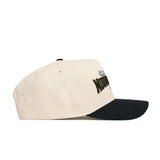 The No Rivals App State Ballpark Hat is a structured beige cotton baseball cap with a black curved brim, seen from the side. The front showcases a yellow and black embroidered design, with some text partially visible.