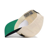 The No Rivals App State Ballpark Hat is displayed upside down, showing its green under-brim and inner labels with text and a QR code. Crafted from high-quality cotton, this beige cap offers comfort and long-lasting durability.