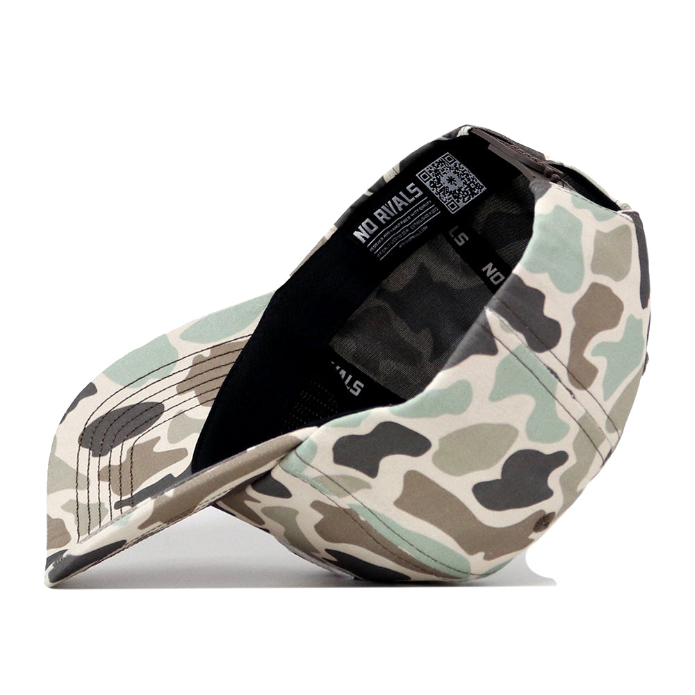 The UCF Knights Huntsman Hat by No Rivals is shown upside down, revealing its black interior, sweatband, and No Rivals label along with a QR code on the inner tag.