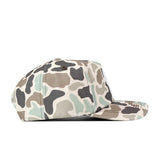 Side view of the No Rivals Ole Miss Rebels Huntsman Hat, an officially licensed flat-brim baseball cap featuring a green, brown, beige, and black camouflage pattern made from high-quality cotton, displayed on a white background.