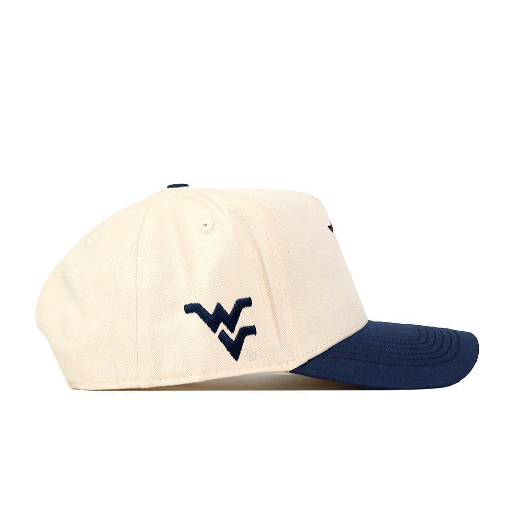 The No Rivals WVU Mountaineers Mascot Patch Hat is a cream-colored baseball cap with a navy blue brim, featuring an embroidered navy WV logo on the side and a convenient snap back closure.