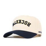 Introducing the No Rivals Toledo Rockets | Upside Down Rockets Hat - Classic: this cream-colored snapback baseball cap features a navy blue brim, with “ROCKETS” stitched upside down in bold yellow and navy letters on the front and “NO RUSH” embroidered on the side. It’s a standout choice for any Toledo Rockets hat collector!.