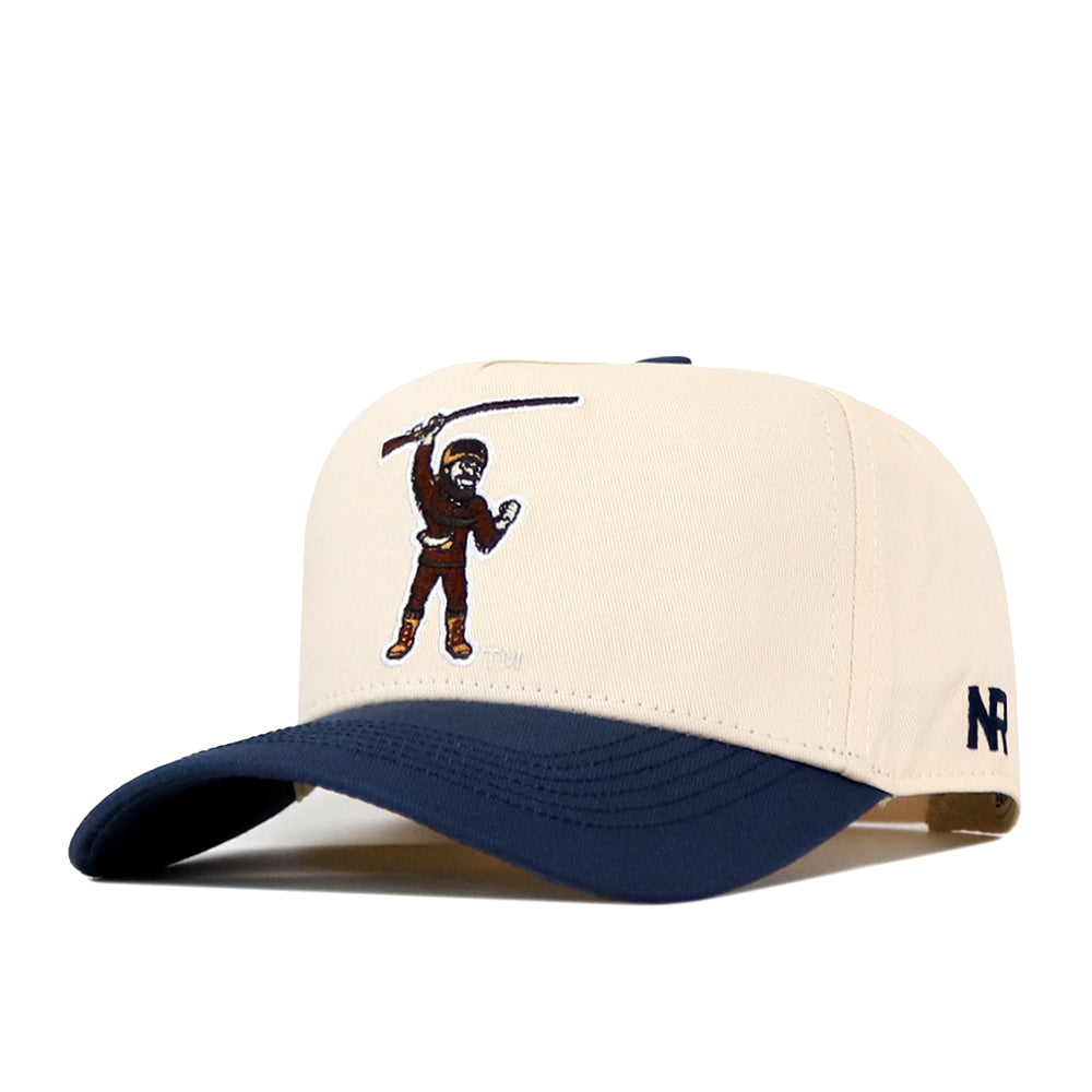 The WVU Mountaineers Mascot Patch Hat by No Rivals is a beige and navy baseball cap featuring an embroidered figure swinging a bat on the front and “NR” embroidered on the side. Crafted with performance fabric, this cap offers comfort and durability with every wear.
