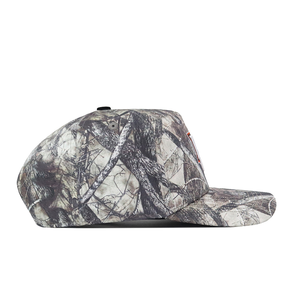 A side view of the No Rivals Bowling Green State Falcons Outland Hat—a flat-brimmed snapback with a camouflage pattern of branches and leaves, featuring an embroidered logo—set against a white background.
