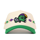 The No Rivals Tulane Mardi Gras Argyle Hat is a cream and green baseball cap showcasing a cartoon green wave mascot holding a Tulane banner, highlighted by yellow and purple diamond accents on the front panel. This officially licensed cap features an embroidered logo and an adjustable snap back for the perfect fit.