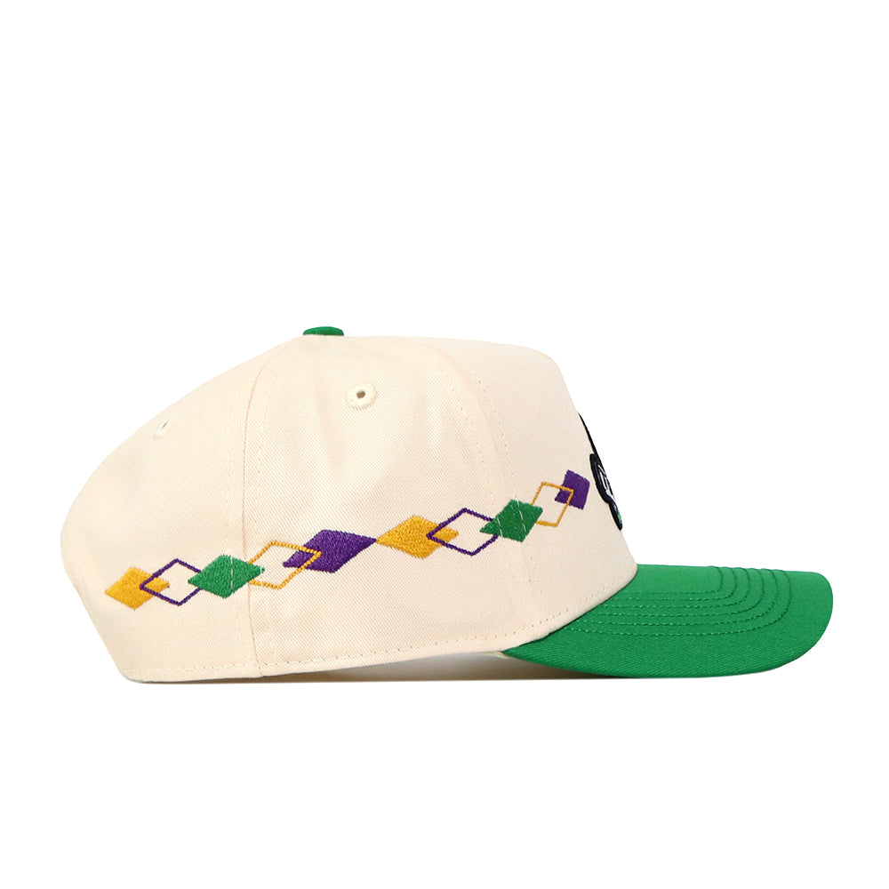 Introducing the Tulane Mardi Gras Argyle Hat by No Rivals—a cream-colored baseball cap with a green brim, accented by a striking geometric argyle pattern in purple, yellow, and green along the side. This officially licensed hat features an embroidered logo and an adjustable snap back for a perfect fit.