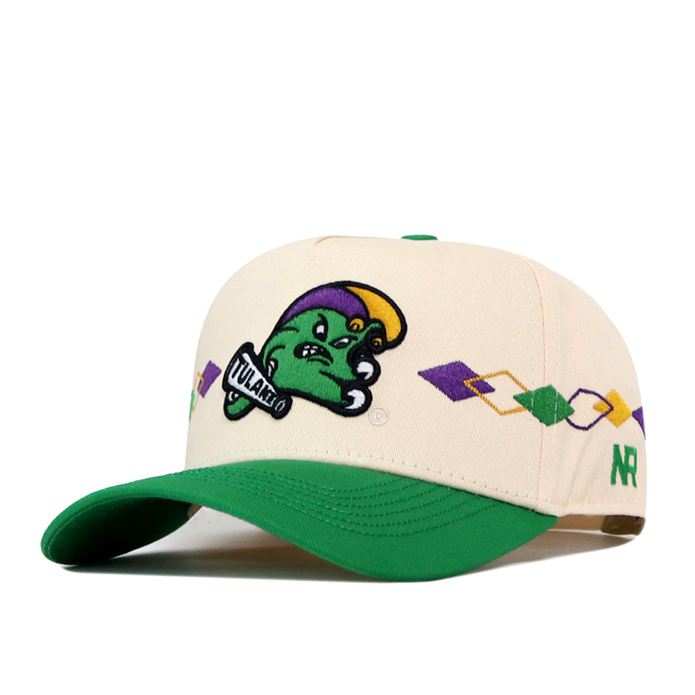The No Rivals Tulane Mardi Gras Argyle Hat features a cream baseball cap with a green bill, a distinctive purple and yellow diamond pattern, and a patch of a green cartoon character sporting a yellow and purple hat. This snapback design also includes an embroidered logo for enhanced detail and style.