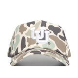 The Utah Huntsman Hat by No Rivals is a 5-panel snap back featuring duck camo in beige, brown, green, and black, with a white embroidered UU logo on the front.