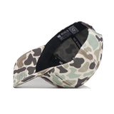 The Utah Huntsman Hat by No Rivals, a duck camo 5-panel style, is shown on its side with the inside band displaying “NO RIVALS” in white text against a plain white background.