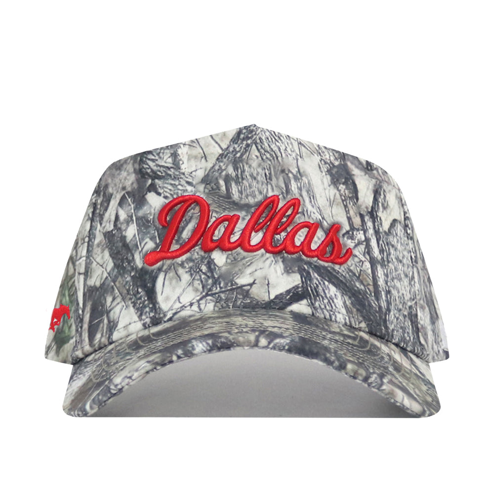 The SMU Outland Hat by No Rivals is a cotton camouflage snapback baseball cap with "Dallas" embroidered in red script on the front. This officially licensed hat offers standout style and a perfect fit.