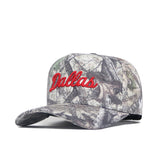 The No Rivals SMU Outland Hat is an officially licensed camouflage cap with “Dallas” embroidered in red script. Made from quality cotton, it features a curved brim and a green, brown, and beige camo pattern.