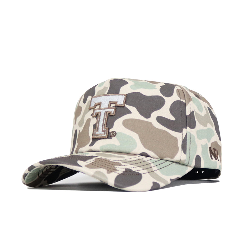 The Texas Tech Huntsman Hat by No Rivals is a 5-panel camo baseball cap featuring an embroidered double T logo on the front, New Era logo on the left, snapback closure, and a stylish blend of green, beige, and brown shades.