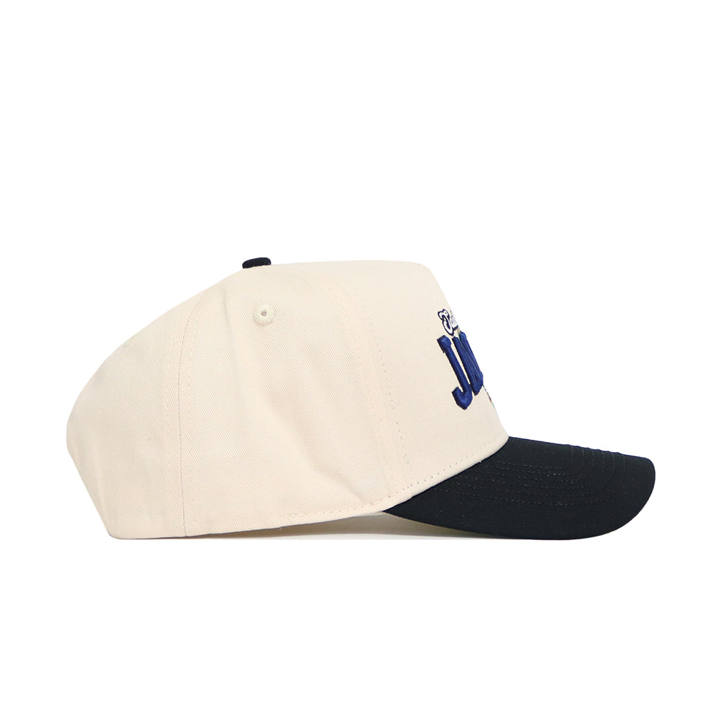 The No Rivals South Alabama Ballpark Hat is a beige structured cotton cap with a black curved brim, blue embroidered front lettering, and a small bear graphic. Features snapback closure for easy adjustment and is shown in side view.