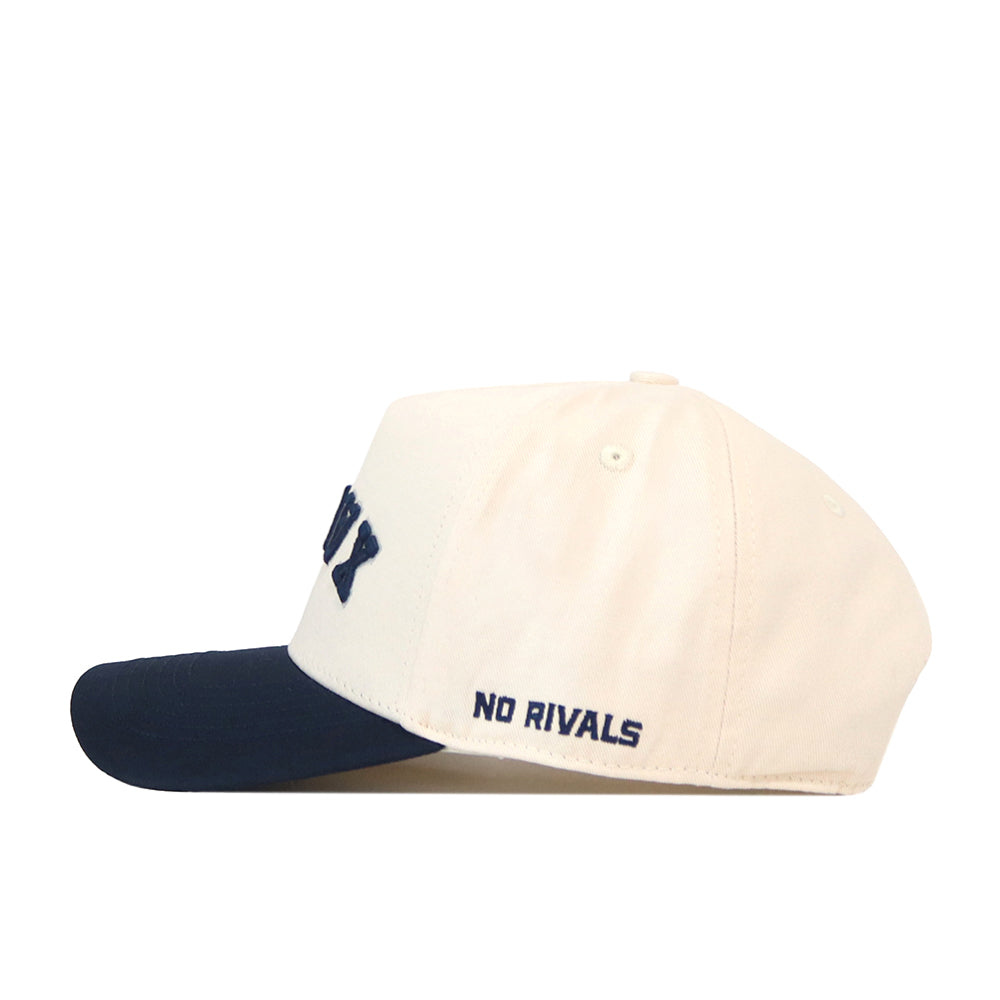 Show your Xavier spirit with the officially licensed Xavier Musketeers | Upside Down Xavier Hat – Classic by No Rivals. This white baseball cap features a navy blue brim and has “NO RIVALS” embroidered in navy blue letters on the side.