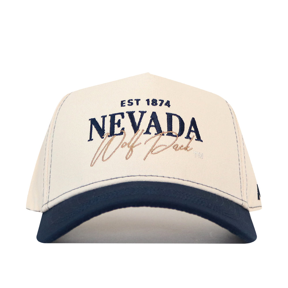 The No Rivals Nevada Wolf Pack Vintage Hat is a white and navy baseball cap with “EST 1874 NEVADA Wolf Pack” embroidered on the front, and features a snap back adjustment for the perfect gameday fit.