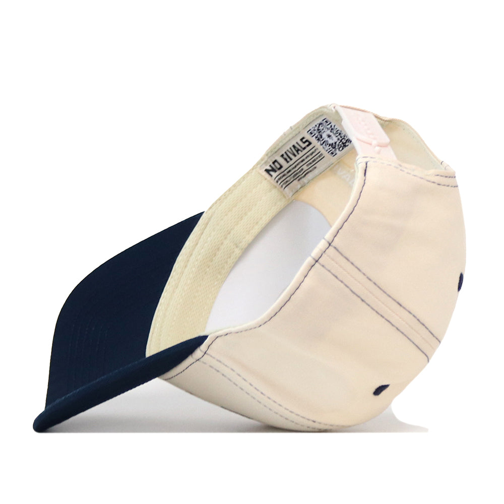 The Nevada Wolf Pack Vintage Hat by No Rivals is displayed upside down, highlighting its interior label and adjustable snap back strap—ideal for showing off the classic design and ensuring your perfect gameday fit.