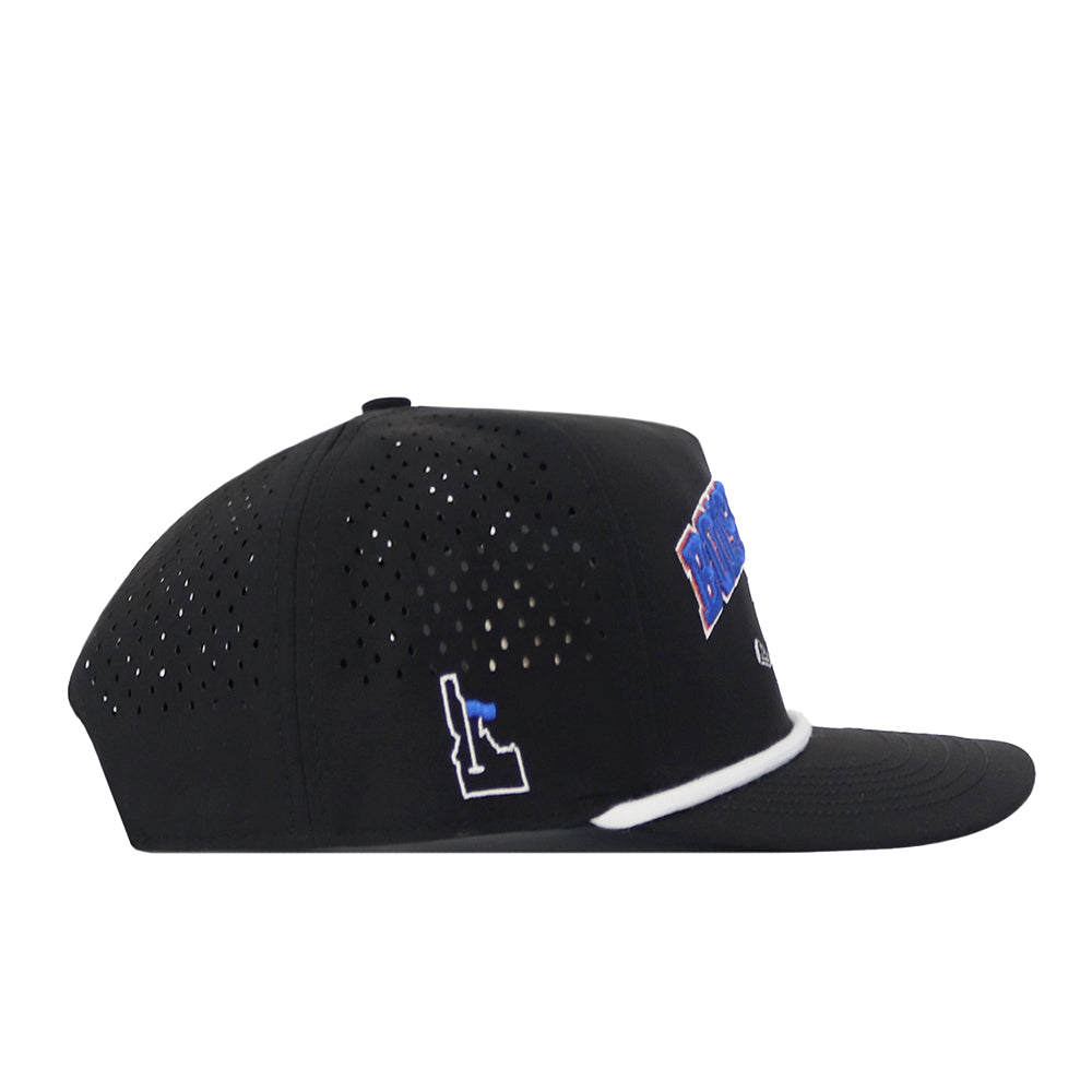 The No Rivals Boise State Golf Hat in black features ventilation holes, a white outline of Idaho, a blue side design, and white trim above the brim. This snap back cap displays an officially licensed embroidered logo and is shown in a side profile view against a white background.