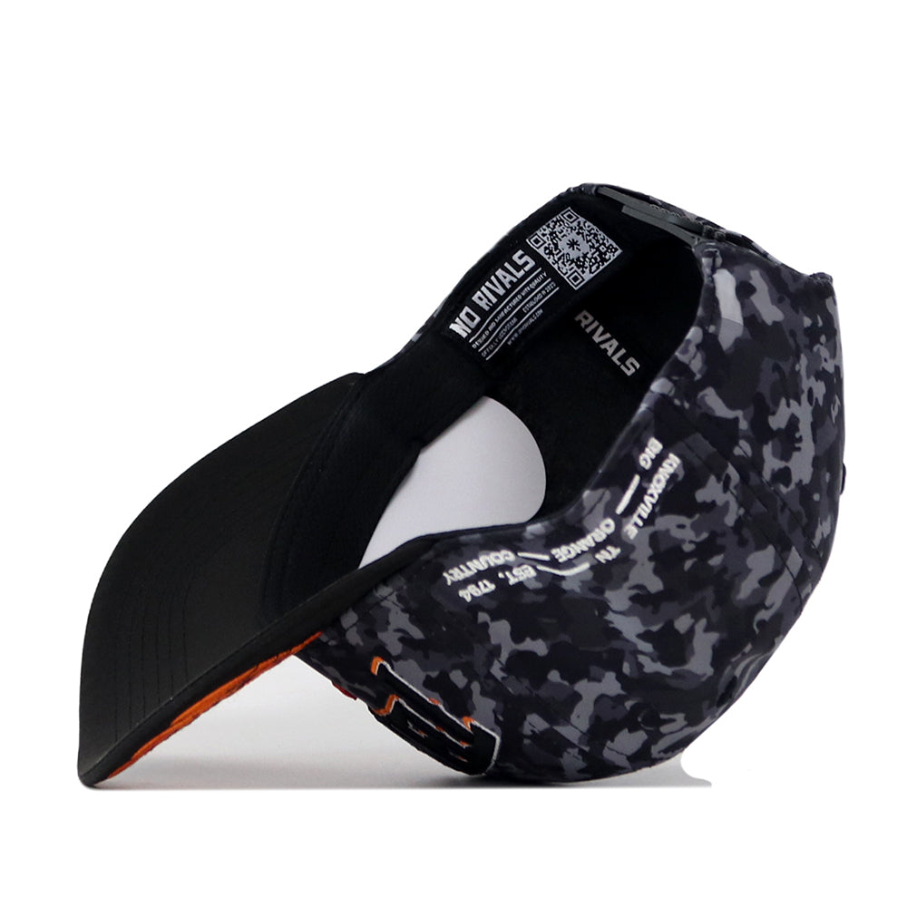 A black No Rivals Tennessee Volunteers 2026 Military Appreciation Hat in gray and black camouflage, shown from the underside to highlight the curved brim and inside label details. This officially licensed snapback features an embroidered logo for a premium finish.