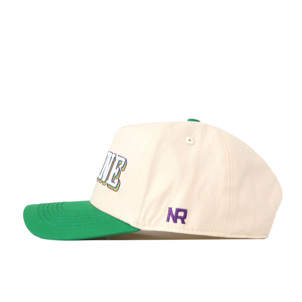 Introducing the Tulane Drop Shadow Hat by No Rivals—a cream-colored baseball cap with a green brim, featuring a purple NR embroidered logo on the side and partially visible multicolored text on the front. Perfect for your next gameday fit, this hat includes an adjustable snap back for a comfortable, customizable wear.