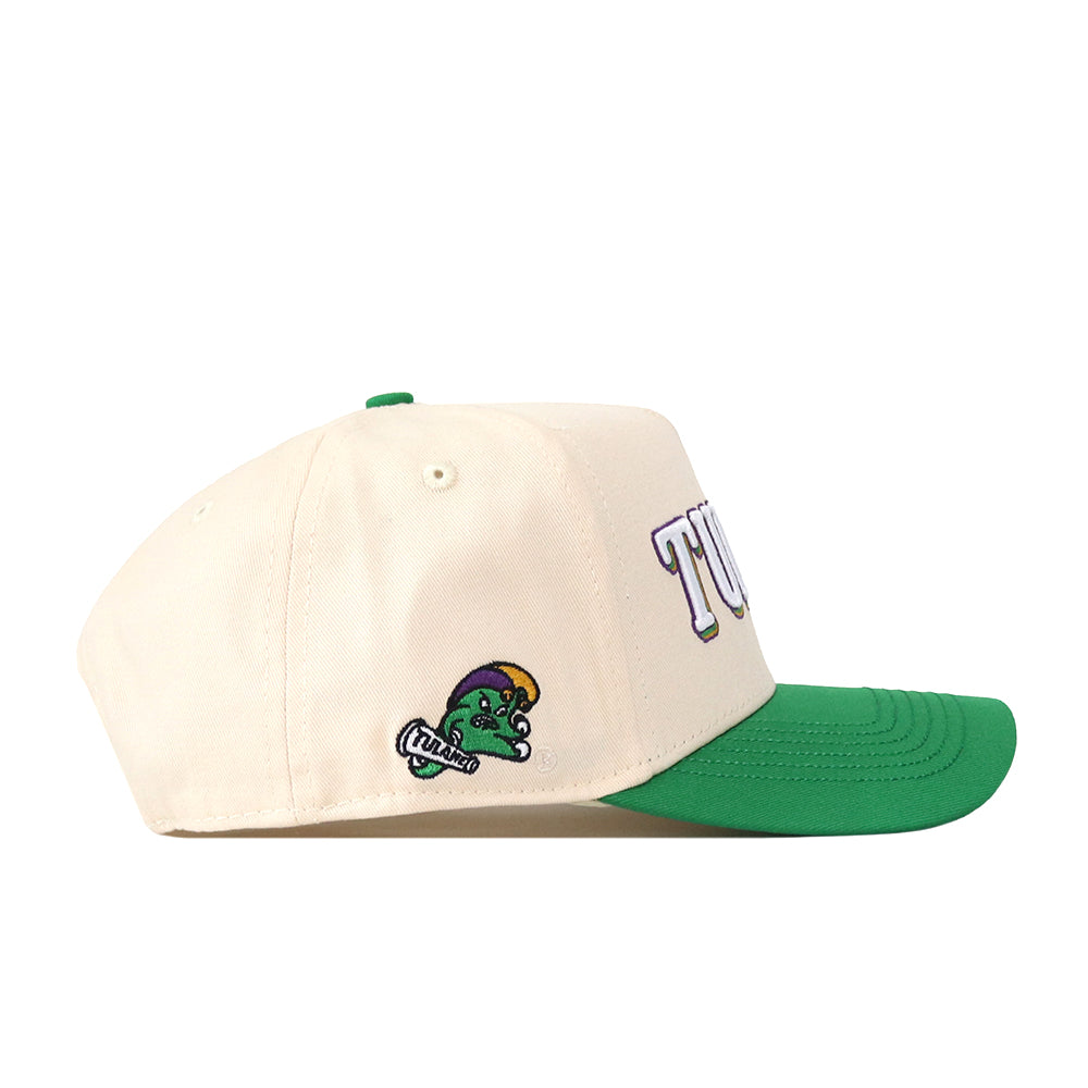 Show your Green Wave pride with the Tulane Drop Shadow Hat by No Rivals—a cream-colored snap back cap with a green brim, featuring bold TUL lettering on the front and a small cartoon mascot embroidered on the side. It’s the perfect finishing touch for your gameday look.