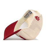 The Indiana Hoosiers Stadium Hat by No Rivals is displayed upside down, revealing the inside label and showcasing the bold red IU embroidered logo on the cream crown with a red brim—an ideal finishing touch for your gameday look.