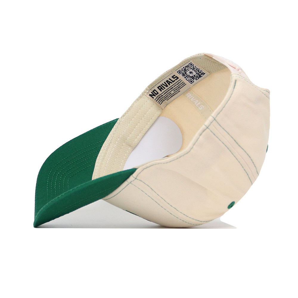 The USF Vintage Hat by No Rivals, shown inside-out, features beige and green colors, visible stitching, a QR code label, and "NO RIVALS" on the inner band. Made from high-quality cotton for comfort.