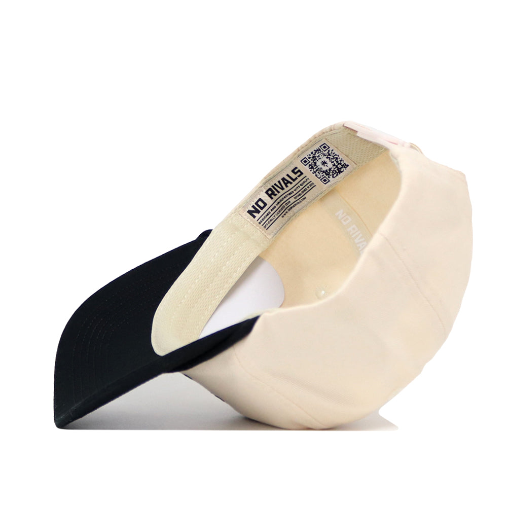 The No Rivals Wake Forest "The Couch" Walk-Off Hat is an adjustable beige and black cotton cap with a black bill, featuring a NO RIVALS label and QR code on the inner band.