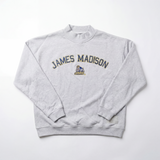 The No Rivals JMU Mock Neck is a light gray, oversized crewneck sweatshirt featuring “JAMES MADISON” in large letters across the chest and a cartoon bulldog mascot above “JMU” at the center.