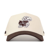 The No Rivals University of Kansas Espresso Hat is a beige structured snapback with a brown brim, featuring the Jayhawk logo in brown and white embroidery on the front.