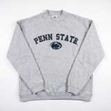 A light gray mock neck sweatshirt by No Rivals, featuring PENN STATE and a navy blue Nittany Lion logo printed on the front. Crafted from heavyweight cotton with a cozy fleece interior, the Penn State Mock Neck is displayed laid flat on a white background.