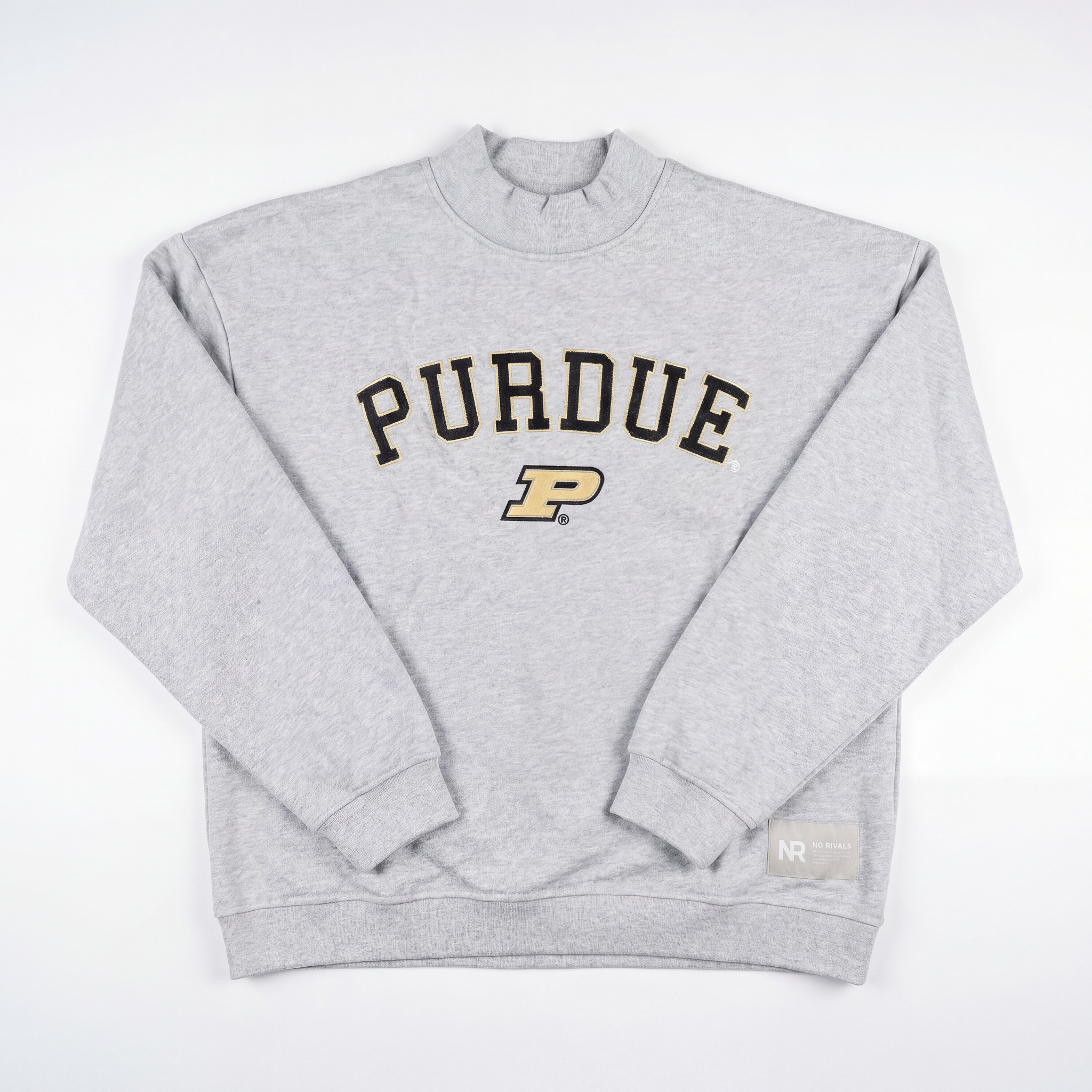 The Purdue Mock Neck by No Rivals is a light gray heavyweight cotton crewneck featuring "PURDUE" in black letters with a gold P logo below and a small NR tag with additional text on the bottom right hem.