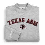 Folded gray No Rivals Texas A&M Mock Neck sweatshirt in an oversized fit with Texas A&M embroidered in maroon and the A&M logo on the chest.