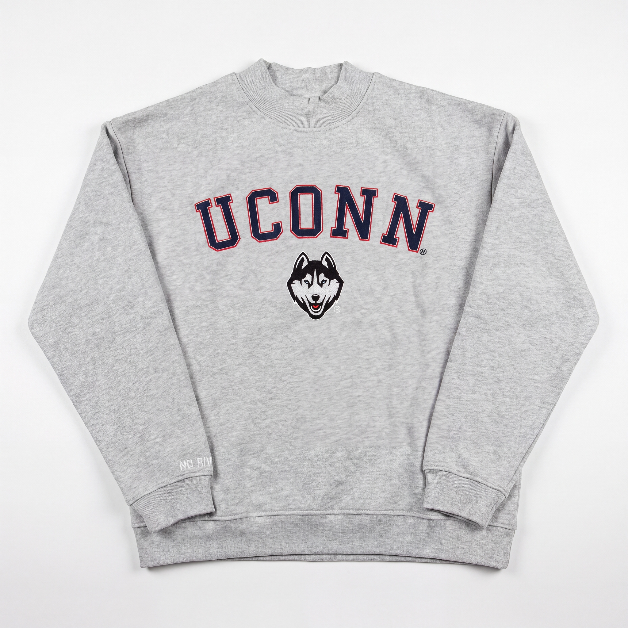 A gray UConn Mock Neck sweatshirt by No Rivals, crafted from heavyweight cotton and designed with an oversized fit for ultimate comfort. The front showcases "UCONN" in bold navy and red letters, with a husky dog logo displayed beneath the text.