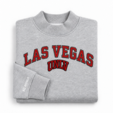 No Rivals UNLV Mock Neck oversized gray sweatshirt featuring the text LAS VEGAS UNLV in red and black athletic-style lettering.