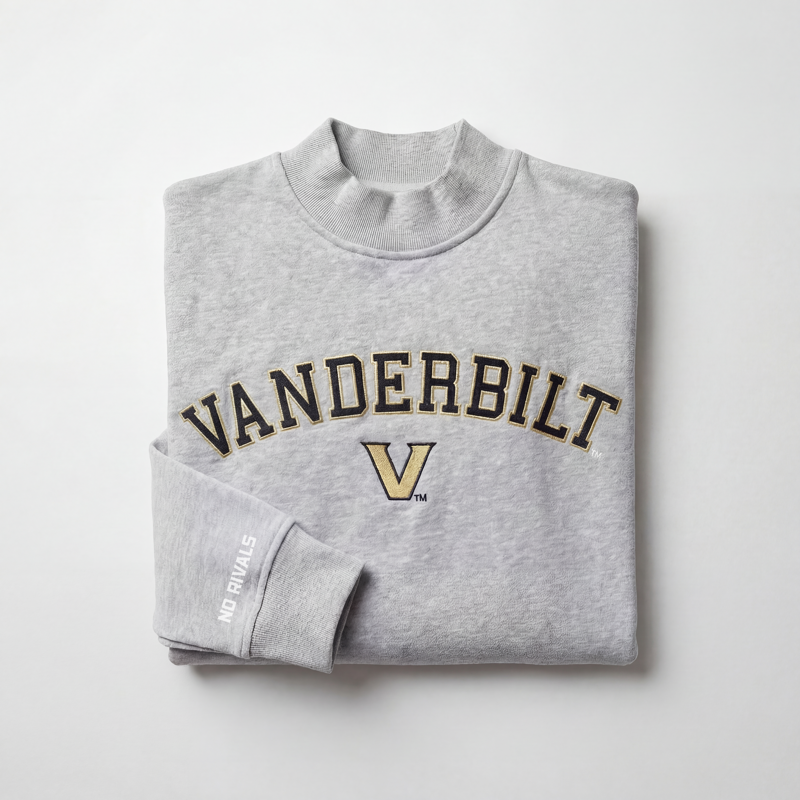 The Vanderbilt Mock Neck by No Rivals is an oversized, heavyweight light gray sweatshirt with VANDERBILT and a large black and gold V embroidered on the front, plus NO RIVALS on the sleeve. Displayed on a plain white background.