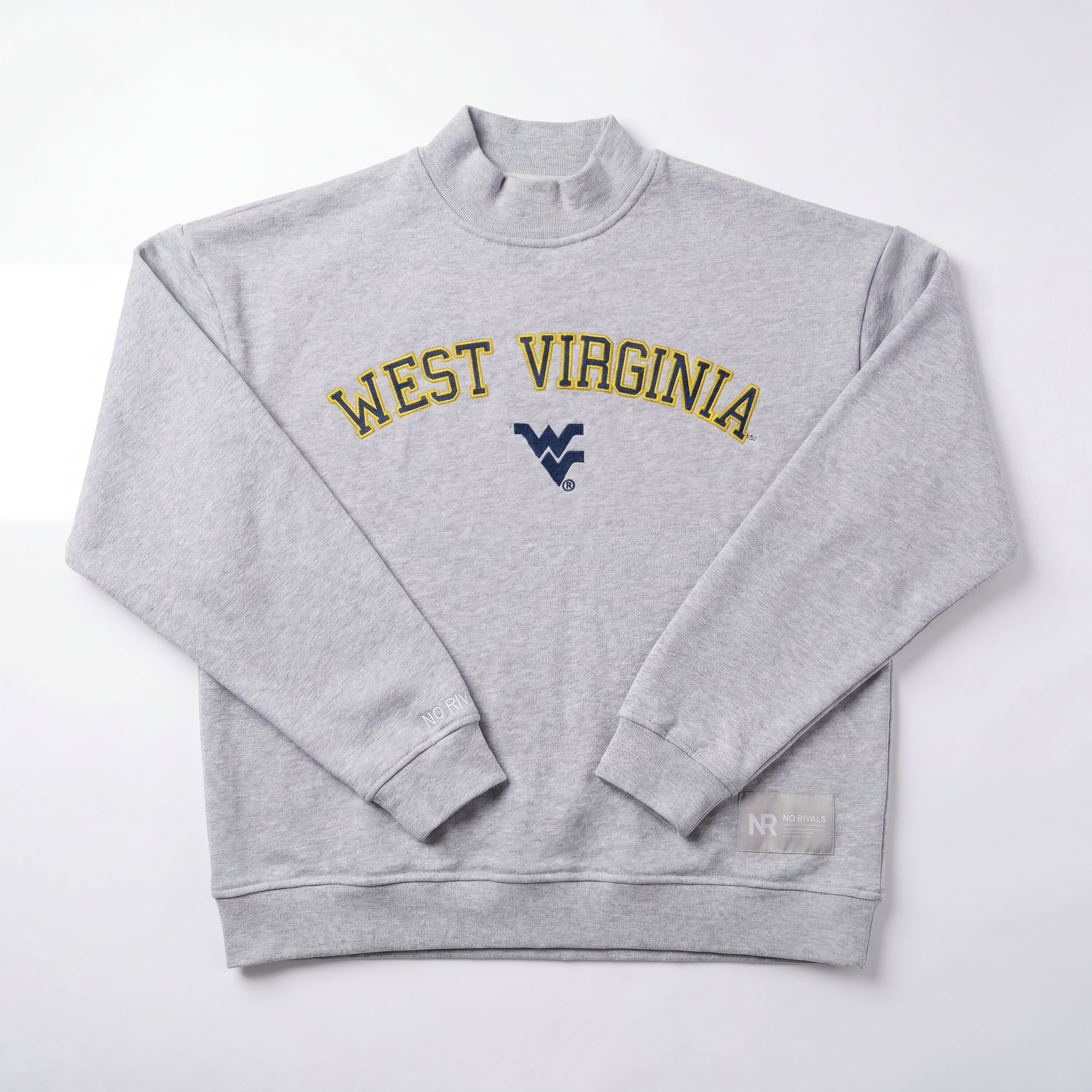 The No Rivals West Virginia Mock Neck is a light gray oversized sweatshirt with "WEST VIRGINIA" in yellow lettering and a blue logo below, featuring a small tag on the lower right. Laid flat on a white background.
