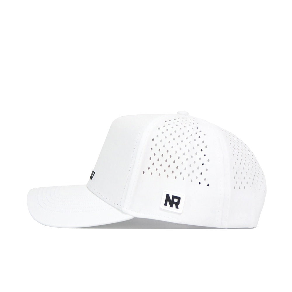 The Mizzou Golf Hat - White is a structured fit cap made from a polyester-cotton blend, with side ventilation holes and a black NR logo patch at the bottom edge. Shown in side profile on a plain white background.